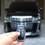 car key in front of an suv